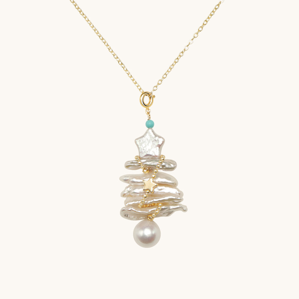 A Christmas tree necklace made of long pearls, star pearl and round pearl.