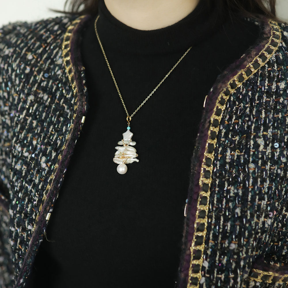 Women wear a baroque pearl pendant.