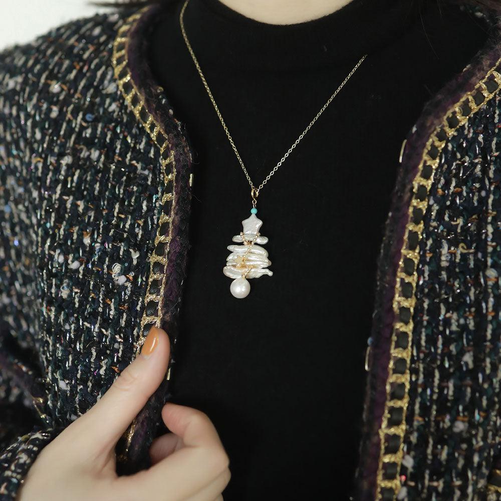 Women wear a cute tree necklace.