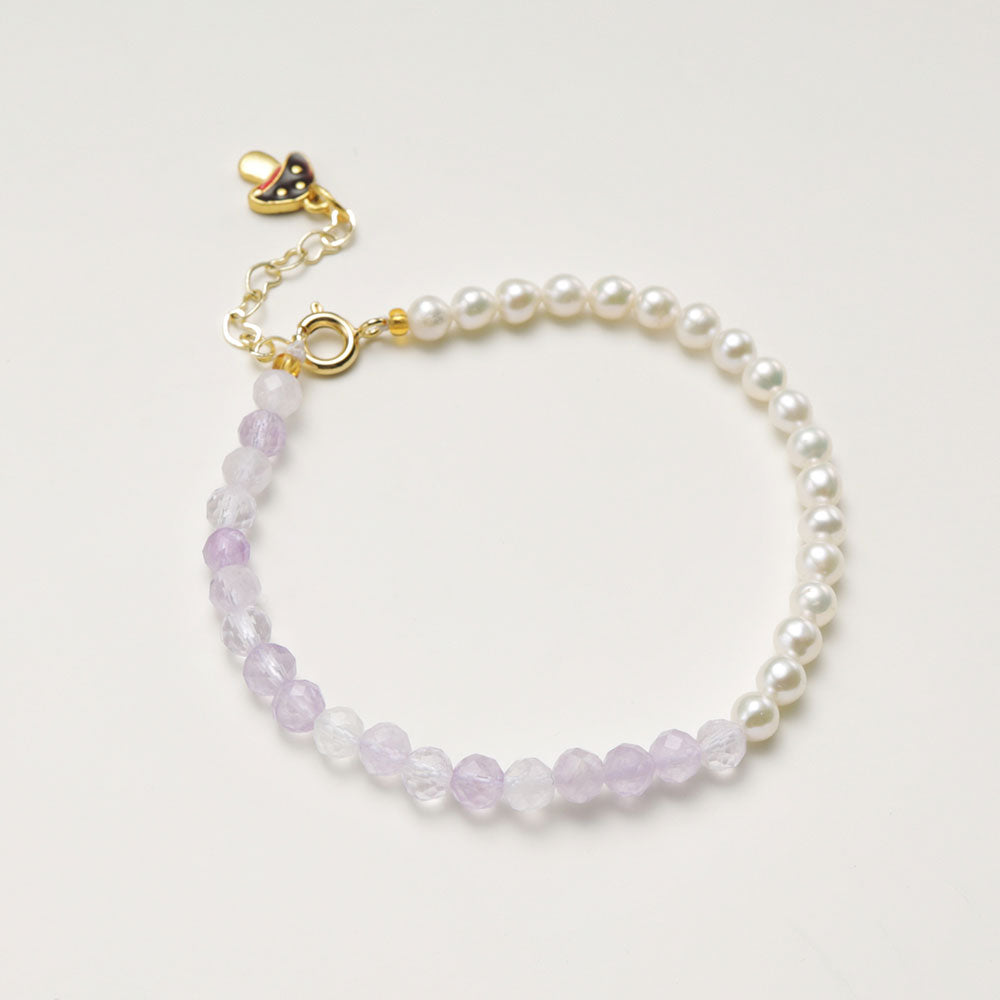 A amethyst stone bracelet with a cute mushroom clasp.