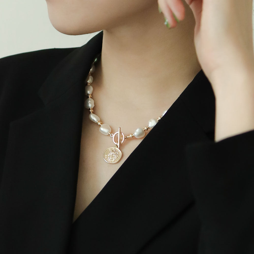 Women wear coin necklace.