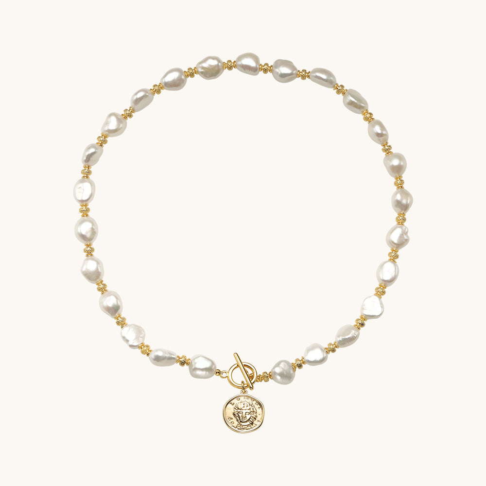 A coin pendant necklace.