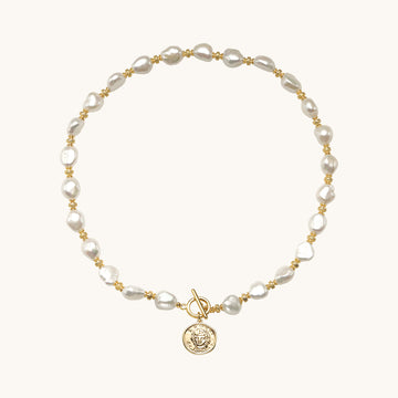 A coin pendant necklace.