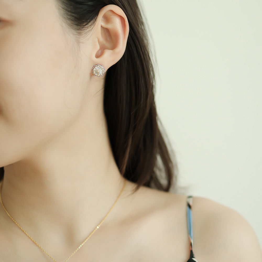 Women wear cubic zirconia stud earrings.