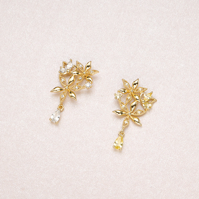 Gold and yellow floral earrings.