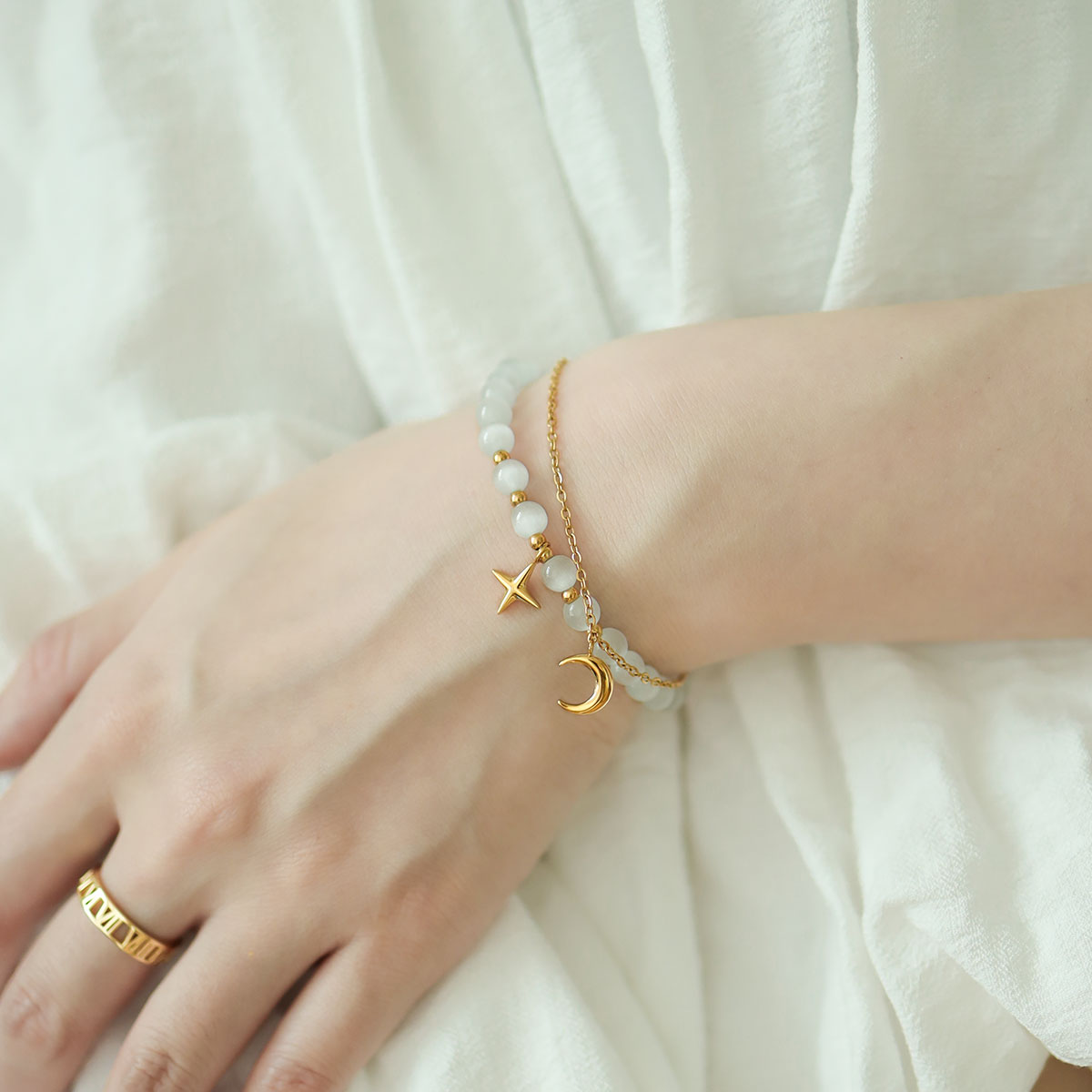 Gold charm bracelet for women.
