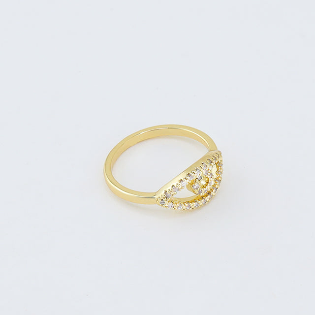 A gold evil eye ring.