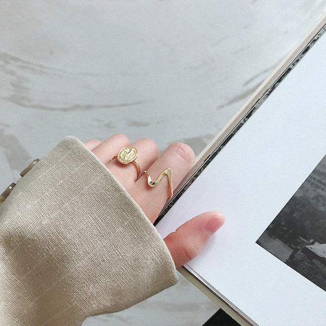 A gold fashion rings on women finger.