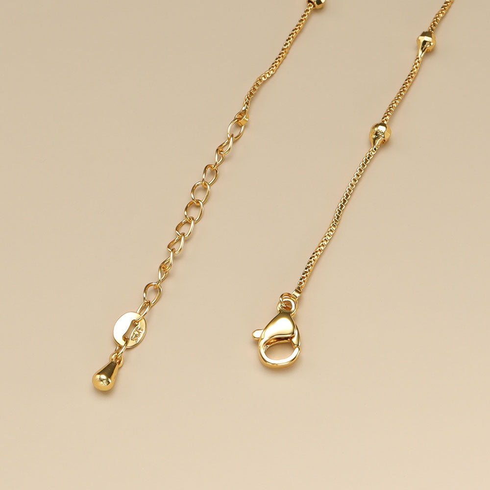 A gold lobster claw clasp.