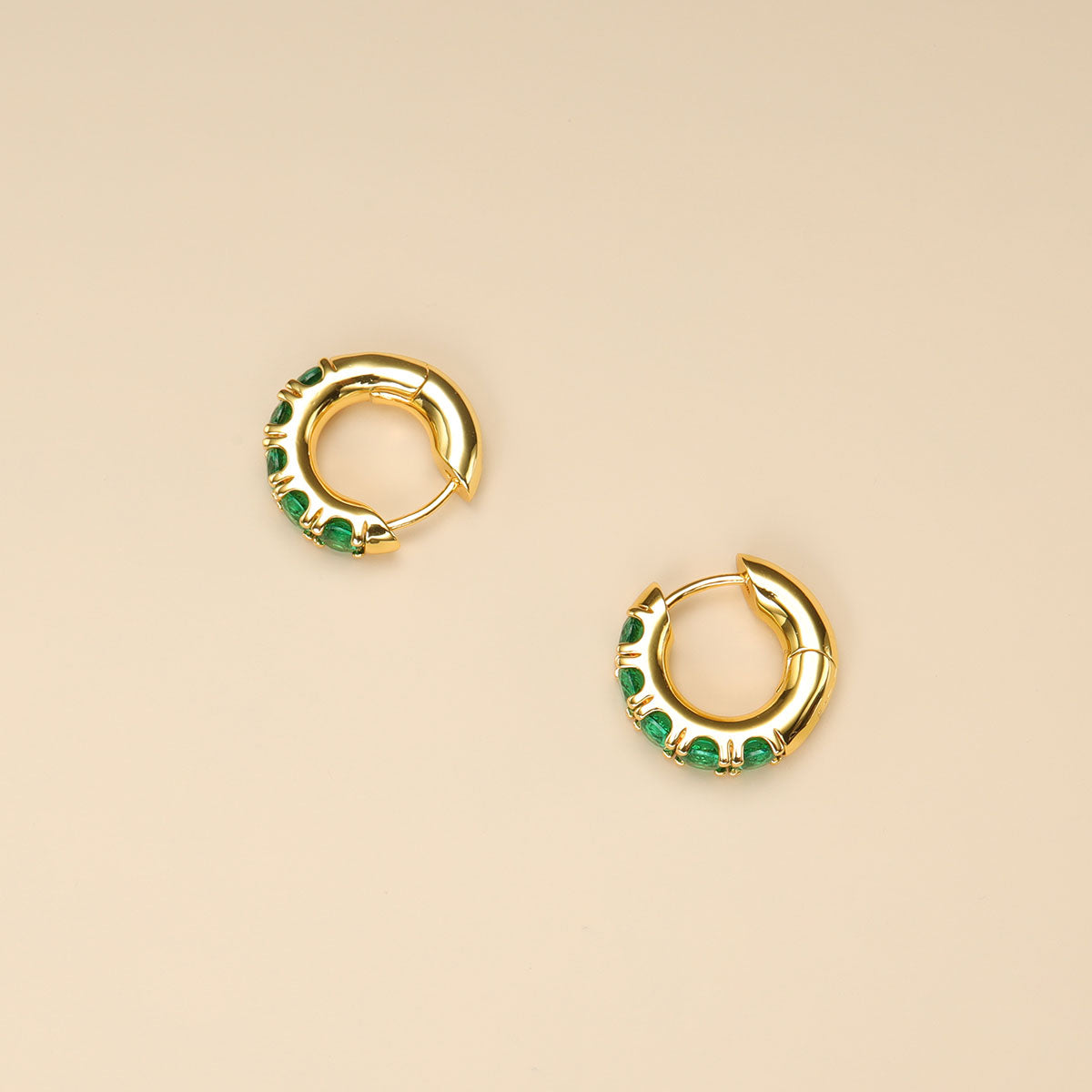 A pair of green stone earrings.