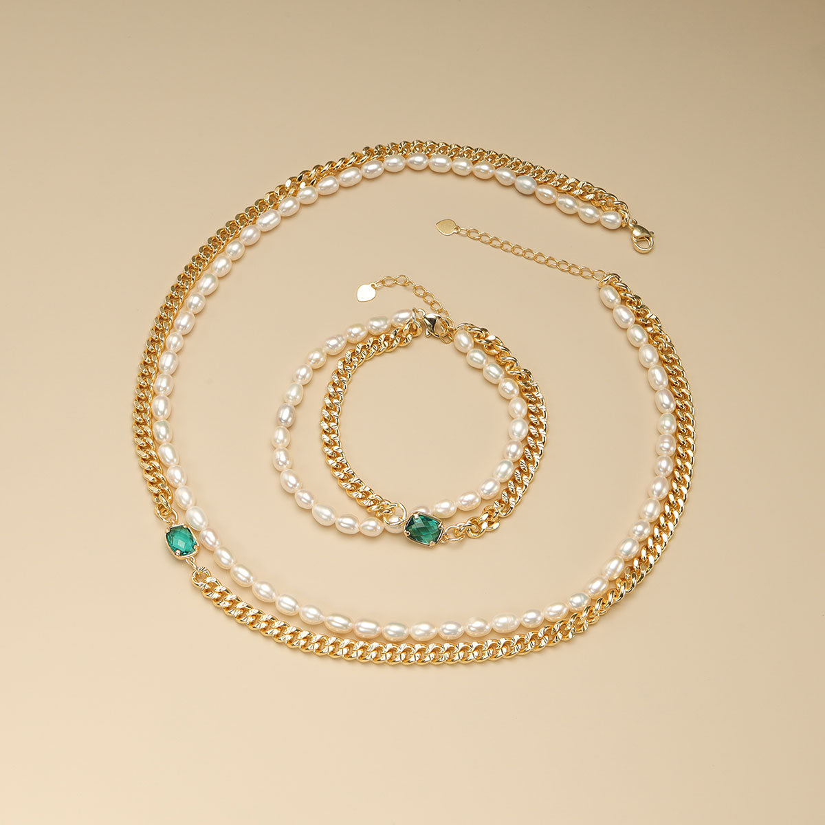 Pearl with gold bracelet and cuban link necklace.
