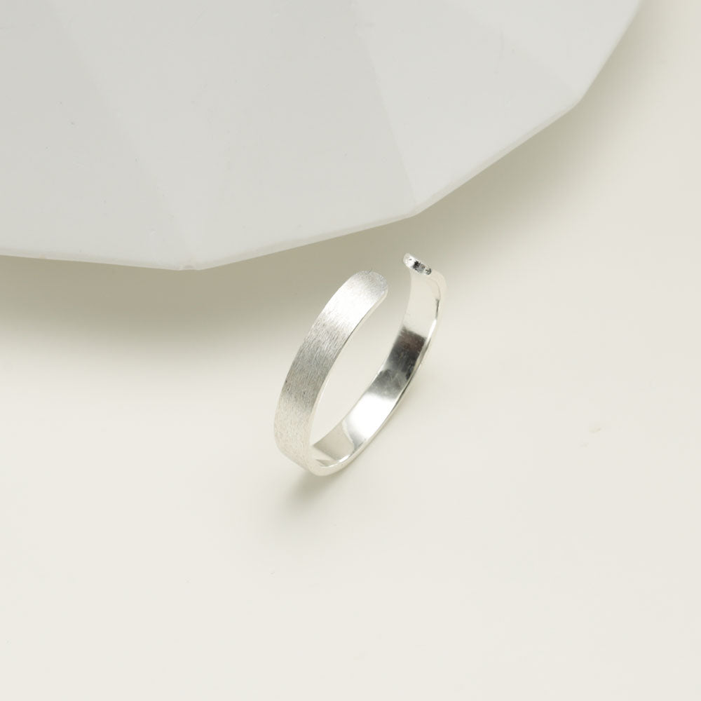 Plain silver ring.