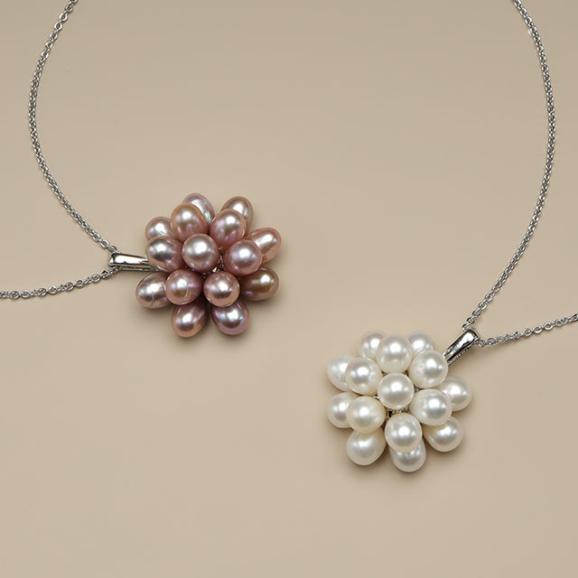 White pearl pendant and purple pearl pendant.