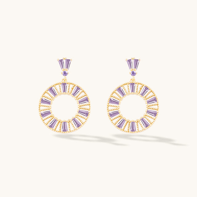 A pair of purple crystal drop earrings.