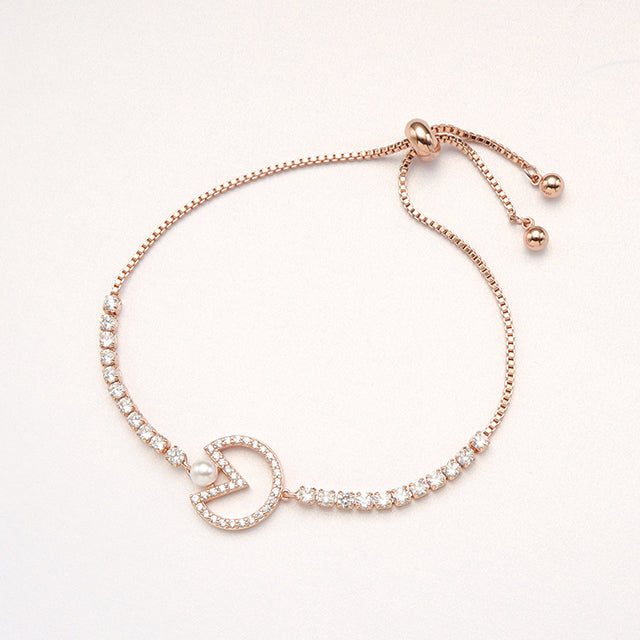 A rose gold chain bracelet.
