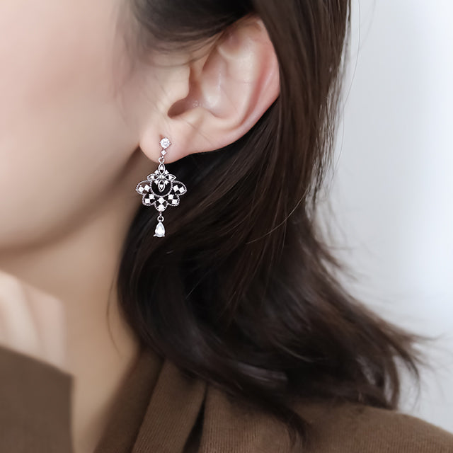 Silver earrings for her.