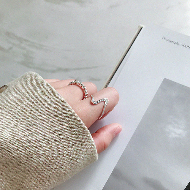 A silver fashion rings on women finger.