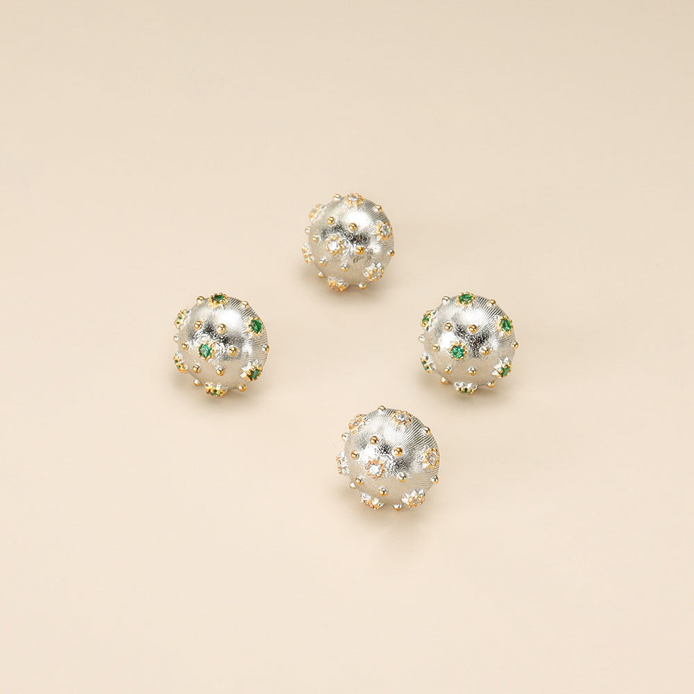 Two pairs of silver statement earrings.
