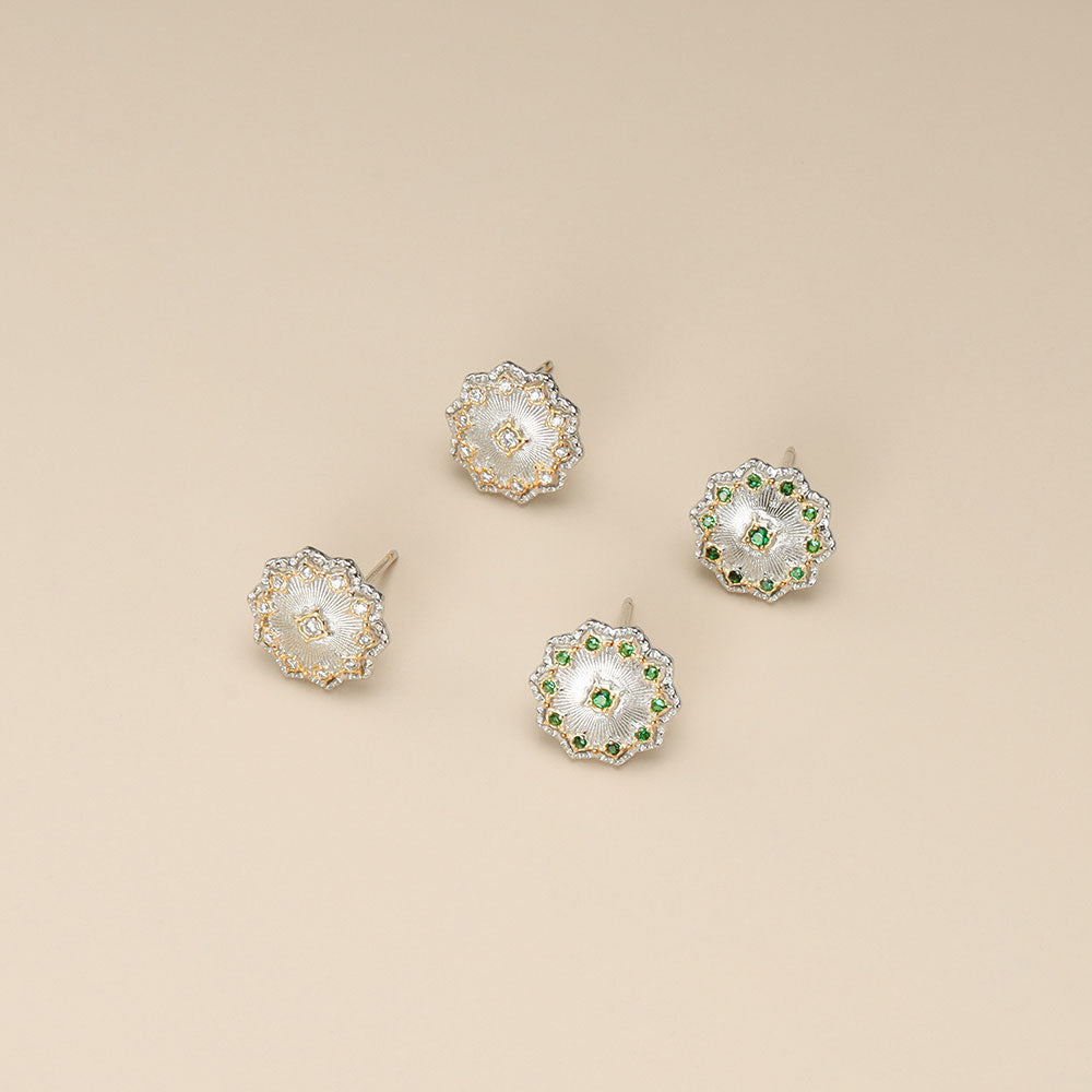 Two pairs of silver stud earrings.
