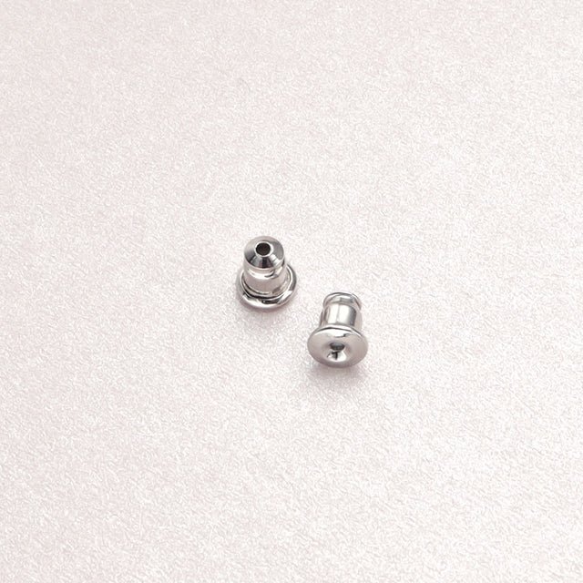 A pair of silver studs earring backs.