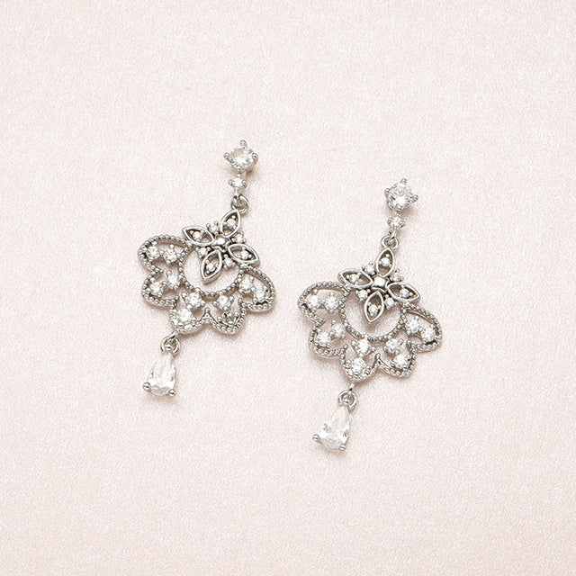 A pair of silver summer earrings.