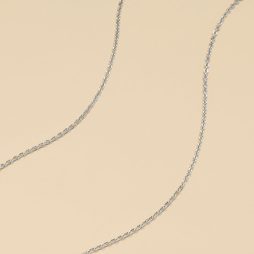 A close shot of simple gold plated chain.