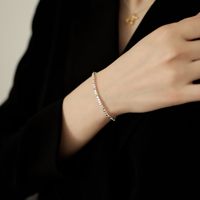 Sterling silver bracelet on wrist.
