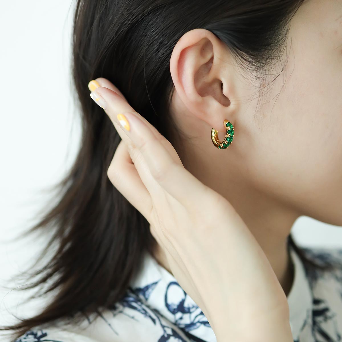 Women wear a thick gold hoops.
