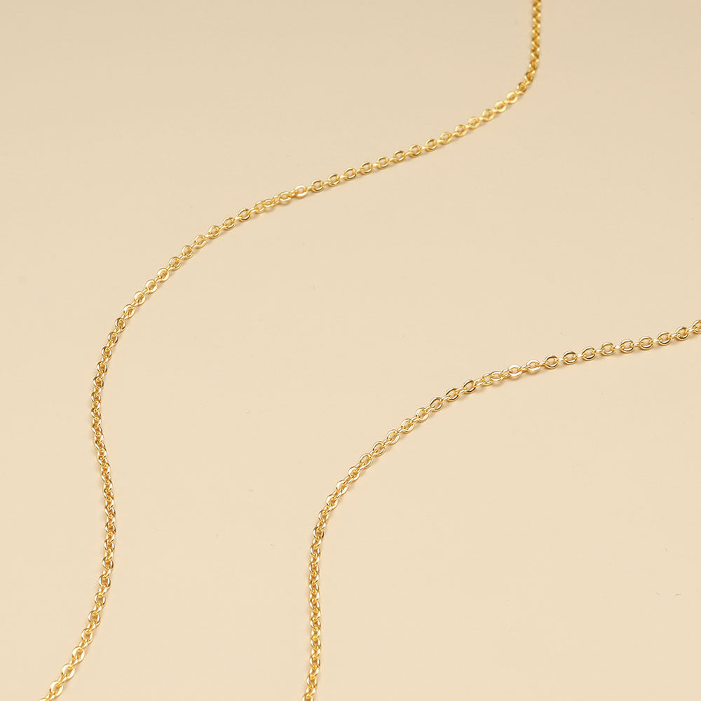A close shot of thin gold chain.