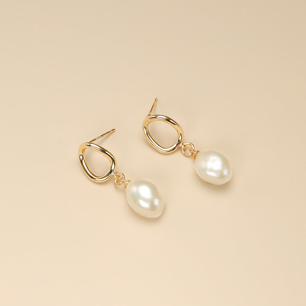 A pair of white pearl earrings,