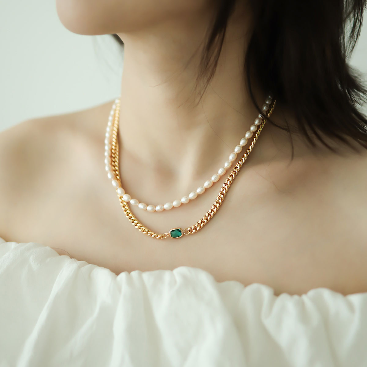 Women wear a y2k necklace.